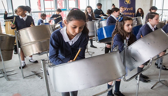 Mace raises £5,700 for steel drum band from Wyvil Primary School